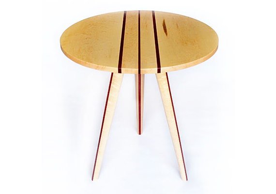 Made from  birdseye maple and purple heart wood; 22.5"L 22.5"W 23.5"H. This piece was made by laminating thin strips of purple heart in between wider boards of birdseye maple. It was hand sanded and given a clear polyurethane finish. The legs were shaped with a hand plane and are mounted into the top with floating tenons.